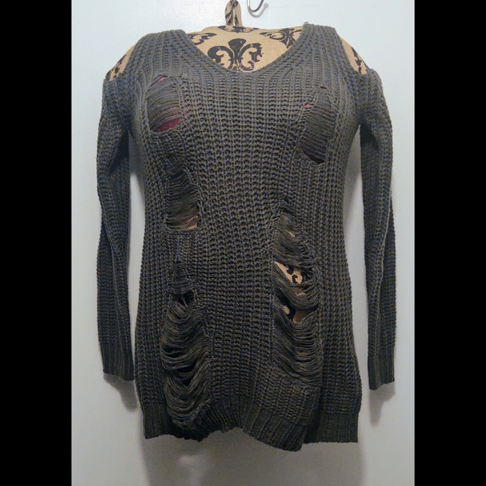 Runway 7 distresses sweater